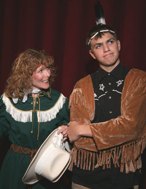 Photograph of Faith Yesner as Annie Oakley and Bradley J. King II as Tommy Keeler